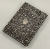 A chased Victorian silver card case embossed with flowers. Birmingham 1848. By Yapp & Woodward.
