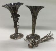 A pair of Japanese silver vases. Circa 1900. Marked and signed to bases.