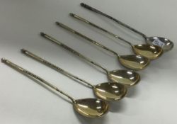 A set of six early Russian engraved silver spoons with spiralled handles.