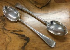 A pair of heavy Victorian silver basting spoons with beaded decoration. London 1872.
