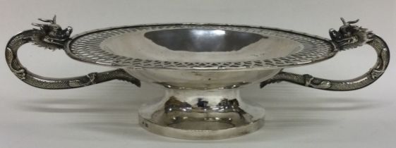 A Chinese export silver bowl decorated with dragons. Circa 1890. Marked to rim.