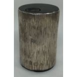 GUERNSEY: A Channel Islands silver table lighter with bark finish.