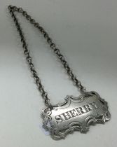 A Victorian silver wine label for 'Sherry' with pierced border. 1848.