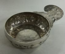 A small antique Continental silver wine taster of typical form.