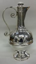 A rare Victorian silver communion wine jug. Sheffield 1879. By Henry Wilkinson.