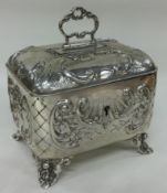 A large 19th Century Austrian silver tea caddy with chased decoration. Marked to base.