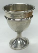 CHESTER: A silver egg cup.