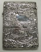 OF MUSICAL INTEREST: A chased silver castle top double-sided card case.