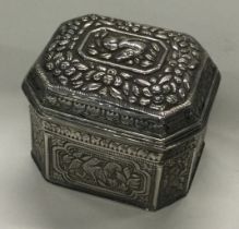 A chased Turkish silver box with lift-off lid chased with animals.