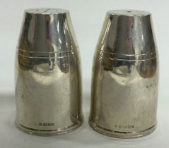 A fine pair of contemporary silver salt and pepper condiments. London 2001. By JAC.