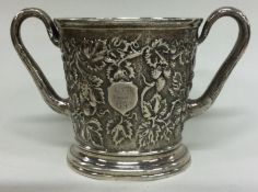 A chased silver cup embossed with vines. Signed underneath by maker. London 1863. By Hunt & Roskell.
