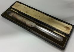 A cased silver handled knife with engraved blade. By James Dixon & Sons.