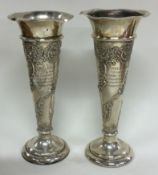 A heavy pair of chased silver vases. London 1903.