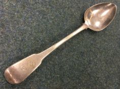 A George III silver basting spoon with crested terminal. London 1810. By Thomas Wilkes Barker.