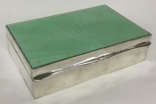 A large silver and enamelled cigar box. Birmingham 1957. By Albert Carter.