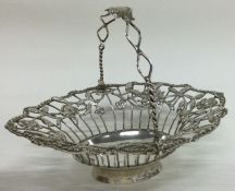 A Georgian silver swing handled basket with pierced decoration. London 1770.