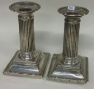 A pair of Victorian silver candlesticks. London 1890. By William & Sons.