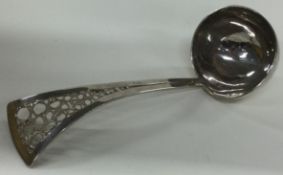 An extra large silver sauce ladle with pierced handle. 1983. By Graham Watling.