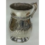 A Victorian silver baluster mug. London 1883. By Charles Stuart Harris.