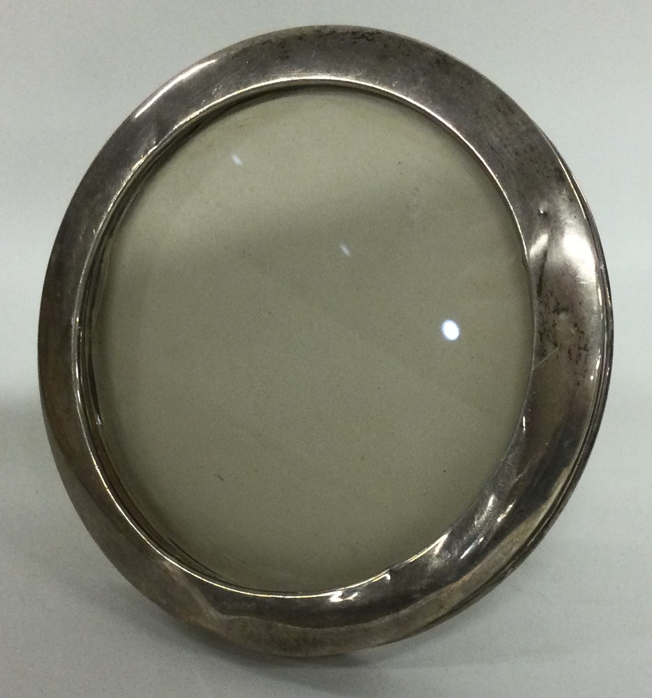 A circular silver picture frame. Birmingham.