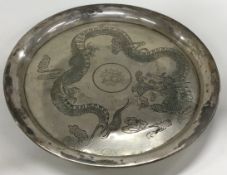 A Chinese export silver salver hand chased with dragons. Marked to base. Circa 1900.