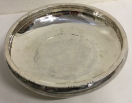 A large Arts & Crafts silver bowl chased with flowers to centre. London 1927. By Cecil Walker.