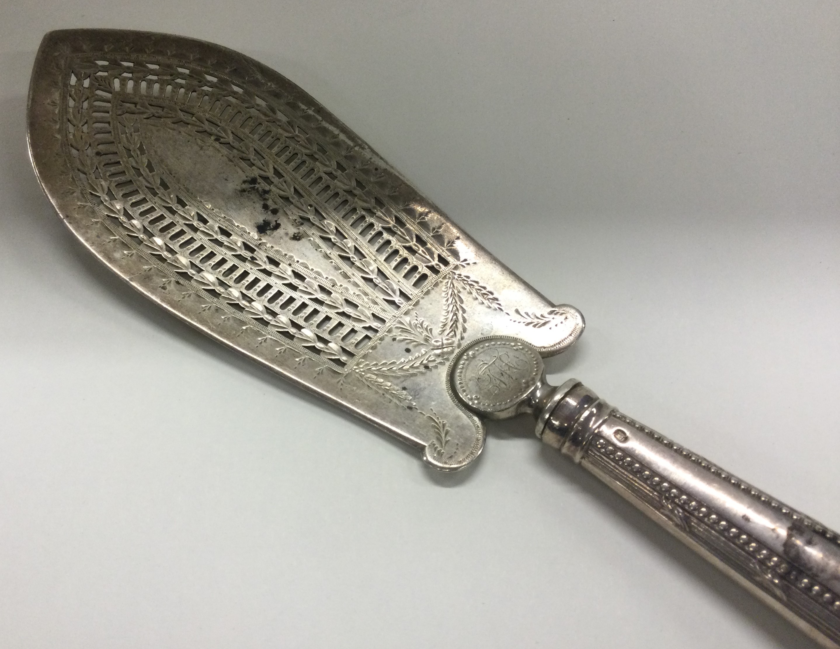 A large pierced Georgian silver fish slice with bright cut decoration. London 1784. - Image 2 of 2