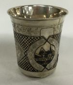 A 19th Century Russian silver and Niello beaker decorated with country scenes. 1886.
