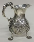 A rare 18th Century silver cream jug with embossed Chinoiserie decoration. London 1756.