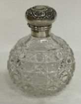 A silver and hobnail glass hinged scent bottle. Birmingham 1906. By Levi & Salaman.