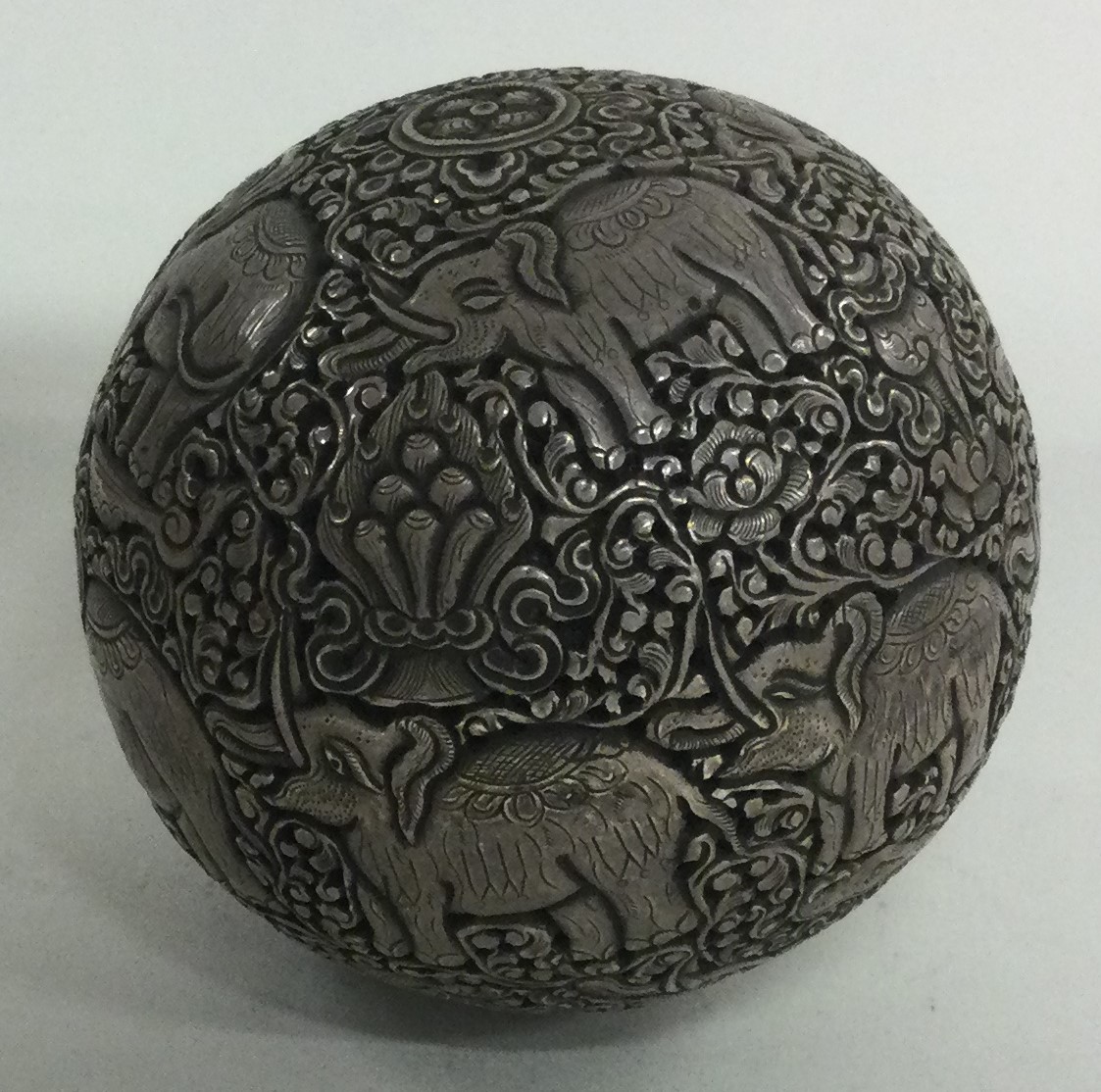 An Indian silver censer with pierced decoration.