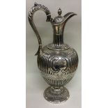 A Victorian silver wine jug with fluted border. Sheffield 1861. By Martin Hall & Co.