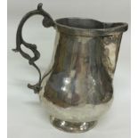 An Indian Colonial silver jug. Marked to base.