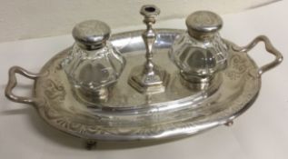 A large Victorian silver inkstand with chamberstick to centre. London 1863. By Henry Wilkinson.