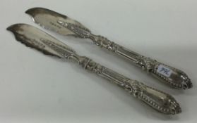 A pair of Victorian silver fish servers.