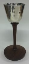 GLASGOW: A fine contemporary Scottish silver goblet on wooden base.