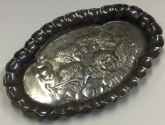 A large chased silver dish. Birmingham 1904.
