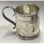 A fine quality chinoiserie silver christening mug with engraved decoration to reeded border.