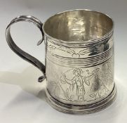 A fine quality chinoiserie silver christening mug with engraved decoration to reeded border.
