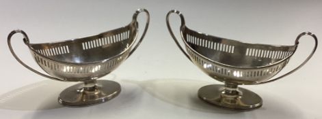 A fine pair of 18th Century George III silver two-handled salt cellars with pierced decoration.