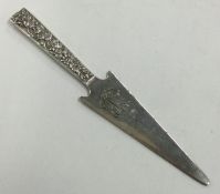 An American silver letter opener chased with flowers.