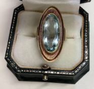 A good stylish topaz single stone ring in 18 carat gold setting.