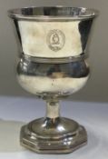 A rare George III silver goblet with central armorial.