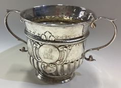 A good George III silver two-handled loving cup with crested decoration.