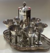 A good silver plated cocktail shaker on tray with six goblets.