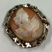 An oval gilt framed cameo of a lady in claw settinng.