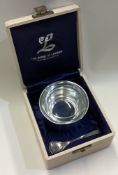 A large silver and glass bowl with spoon in House of Lawrian box.