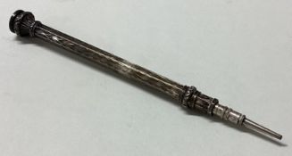 A small engraved silver extending pencil.