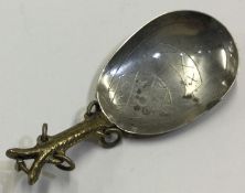 A Continental silver spoon engraved with crosses.