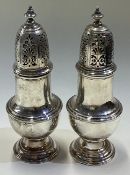 A pair of heavy 18th Century George III silver casters. By Samuel Wood.